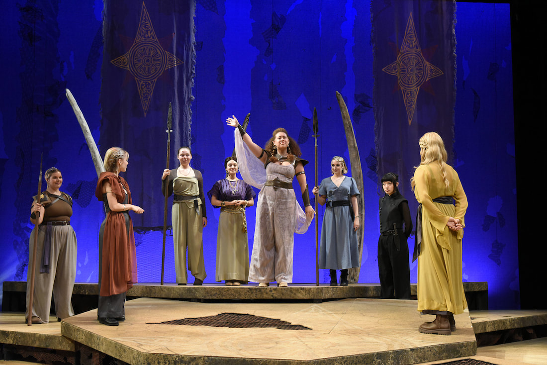 Julius Caesar waves to the people of the twon