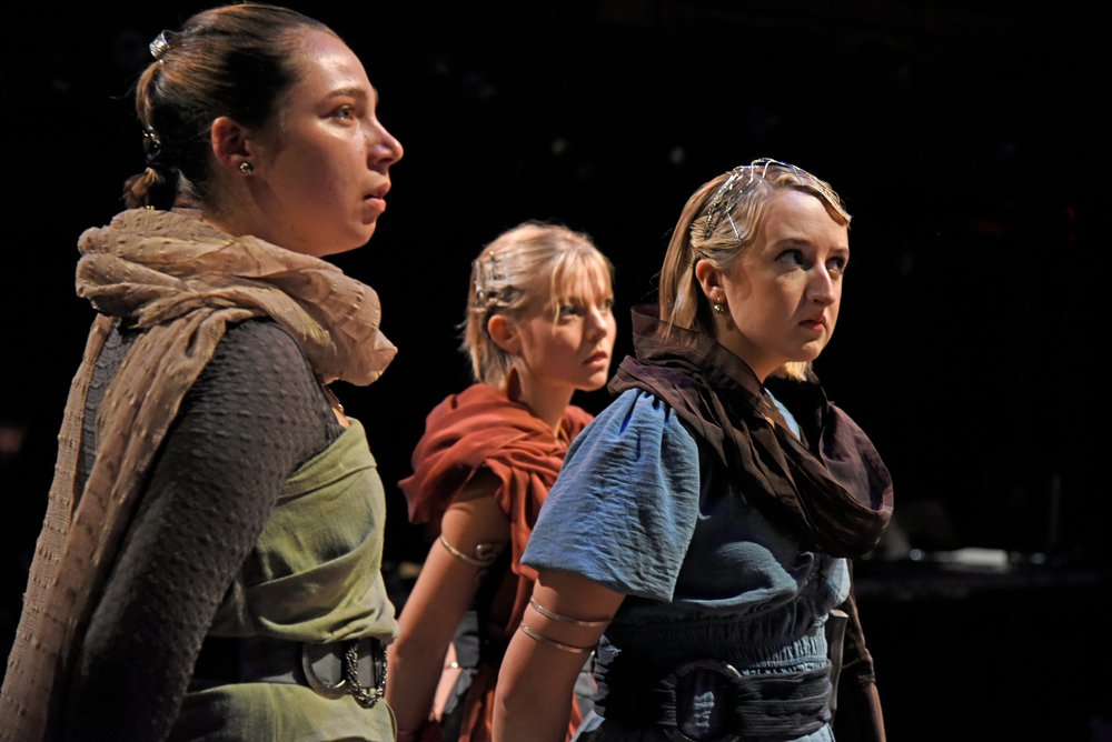 Three women looking off in the distance