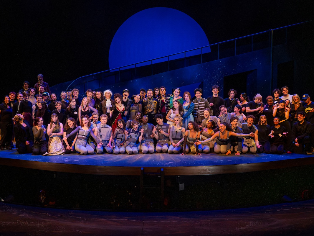 a group of students poses on stage for a company photo of Natasha, Pierre & The Great Comet of 1812