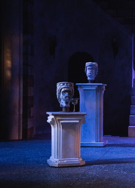 Front of a half-scale hand tailored suit jacket without sleeves or a collar, half with wool and half with just the canvas