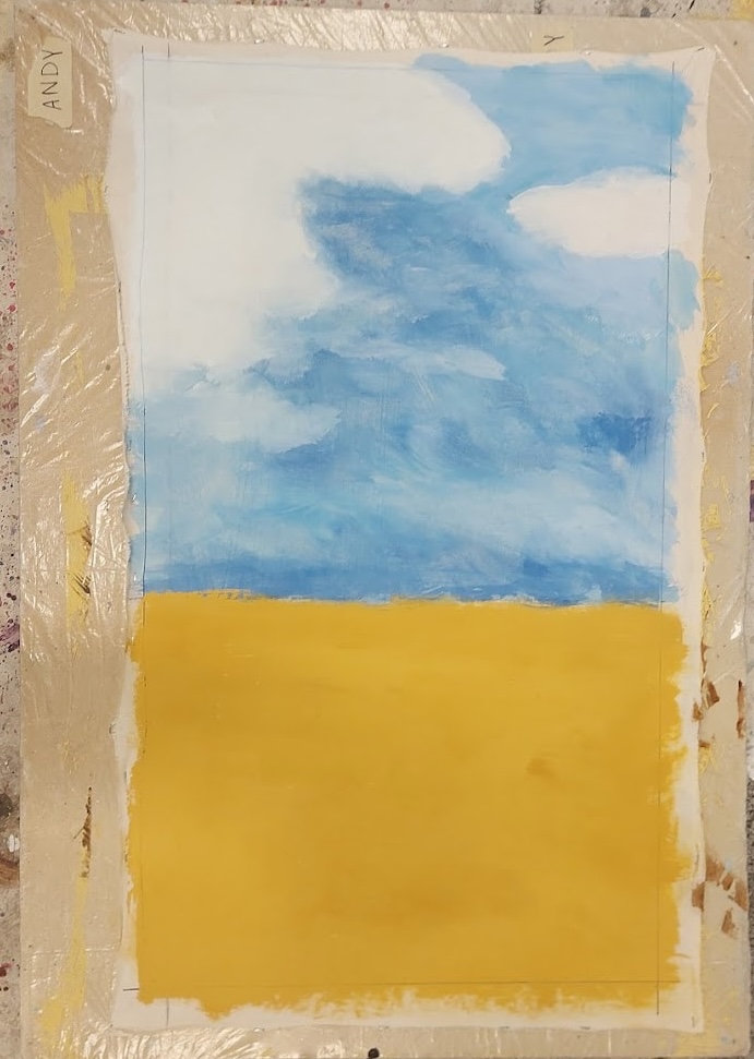 beginnings of a painted landscape with a blue sky and yellow field