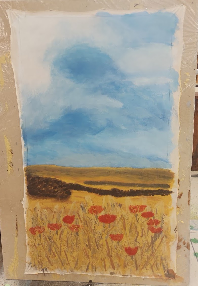 painted landscape with a blue cloudy sky and red poppy flowers in a straw colored field